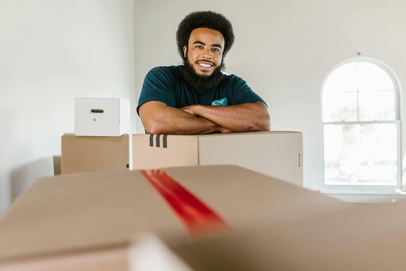 Small business owner packing boxes with U Can Store